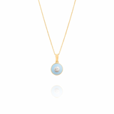 Gold necklace with a blue pendant on a white background  bubble_Pop_Pendant  Tiny Jewels.