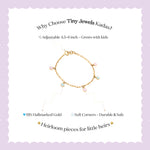 Tiny Jewels gold bracelet with colorful stones on a white background with promotional text about Tiny Jewels Kadas.