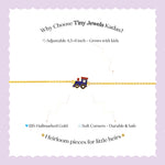Tiny Jewels promotional text about Tiny Jewels Kadas on a white background with a purple border.