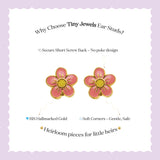 Tiny Jewels flower-shaped earrings with pink petals and yellow centers on a white card with text about the product.