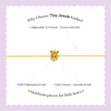 Tiny Jewels gold bracelet with a giraffe design on a white background with text about Tiny Jewels Kadas.