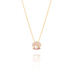 Tiny Jewels necklace with a shell pendant featuring a pearl on a white background