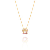 Tiny Jewels necklace with a shell pendant featuring a pearl on a white background