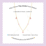 Tiny Jewels gold necklace with pink gemstones on a light purple background with text about the product.
