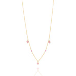 Tiny Jewels gold necklace with pink gemstones on a white background