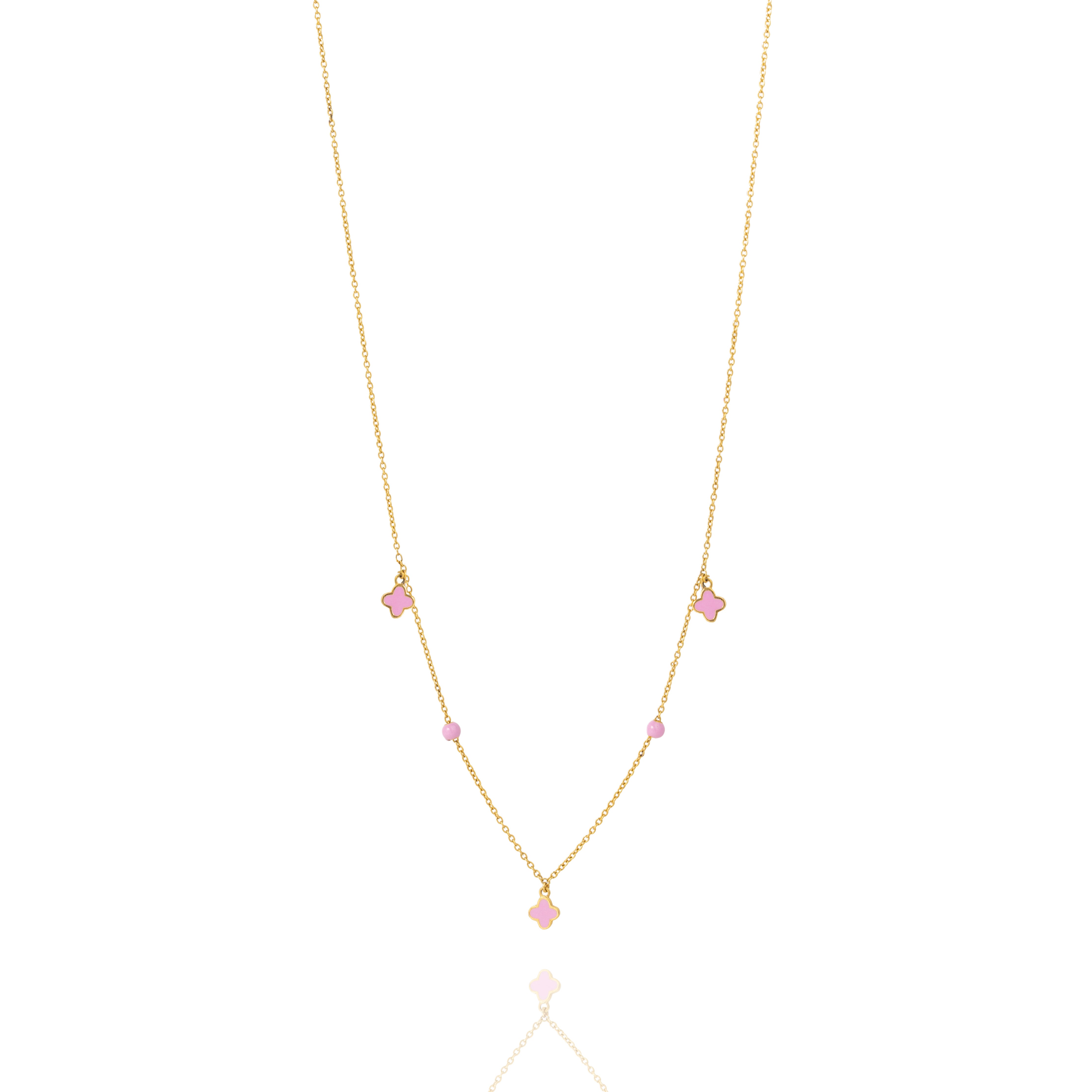 Tiny Jewels gold necklace with pink gemstones on a white background