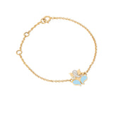 Tiny Jewels gold bracelet with a butterfly charm on a white background