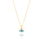 Tiny Jewels Gold pendant with a blue eye design on a white background