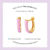 Tiny Jewels gold and pink hoop earrings on a light purple background with text about Tiny Jewels Balis.