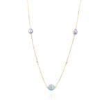 Tiny Jewels delicate necklace with small round pendants on a white background