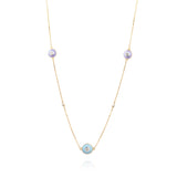 Tiny Jewels delicate necklace with small round pendants on a white background