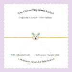 Tiny Jewels branding and product information for Tiny Jewels Kadas on a white background with gold bracelet illustration.