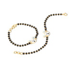 Tiny Jewels black beaded chain with gold clasp and panda charm on a white background