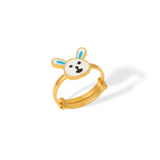 Tiny Jewels gold ring with a cartoonish face design on a white background