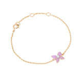Tiny Jewels gold bracelet with a pink butterfly charm on a white background