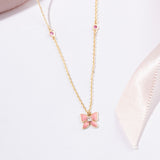 Tiny Jewels pink butterfly pendant necklace on a white background