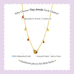 Tiny Jewels gold necklace with small stones on a light purple background, featuring text about the product.