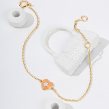 Tiny Jewels gold bracelet with a heart-shaped charm on a white background