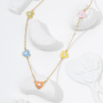 Tiny Jewels necklace with colorful heart-shaped pendants on a white background