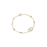 Tiny Jewels gold bracelet with interlocking rings on a white background