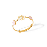 Tiny Jewels gold bracelet with pink and white floral decorations on a white background