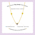 Tiny Jewels gold necklace with small pendant on a light purple background, featuring text about the product.