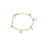 Tiny Jewels gold bracelet with colorful charms on a white background