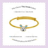 Tiny Jewels gold children's bracelet with bunny design on a light purple background