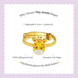 Tiny Jewels gold children's ring with tiger design on a light purple background