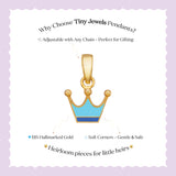 Tiny Jewels gold crown pendant with blue center on a white card with text about Tiny Jewels Pendants.