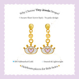Tiny Jewels gold earrings with heart designs on a purple background, featuring text about 'Tiny Jewels Drops'.