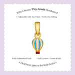 Tiny Jewels Gold hot air balloon pendant with text on a light purple background