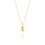 Tiny Jewels Gold pendant with a yellow crescent moon and white bear on a white background