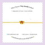 Tiny Jewels gold bracelet with a cartoon character on a white background with promotional text about Tiny Jewels Kadas.