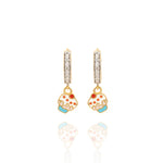 Tiny Jewels pair of earrings with cupcake designs on a white background