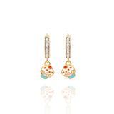 Tiny Jewels pair of earrings with cupcake designs on a white background