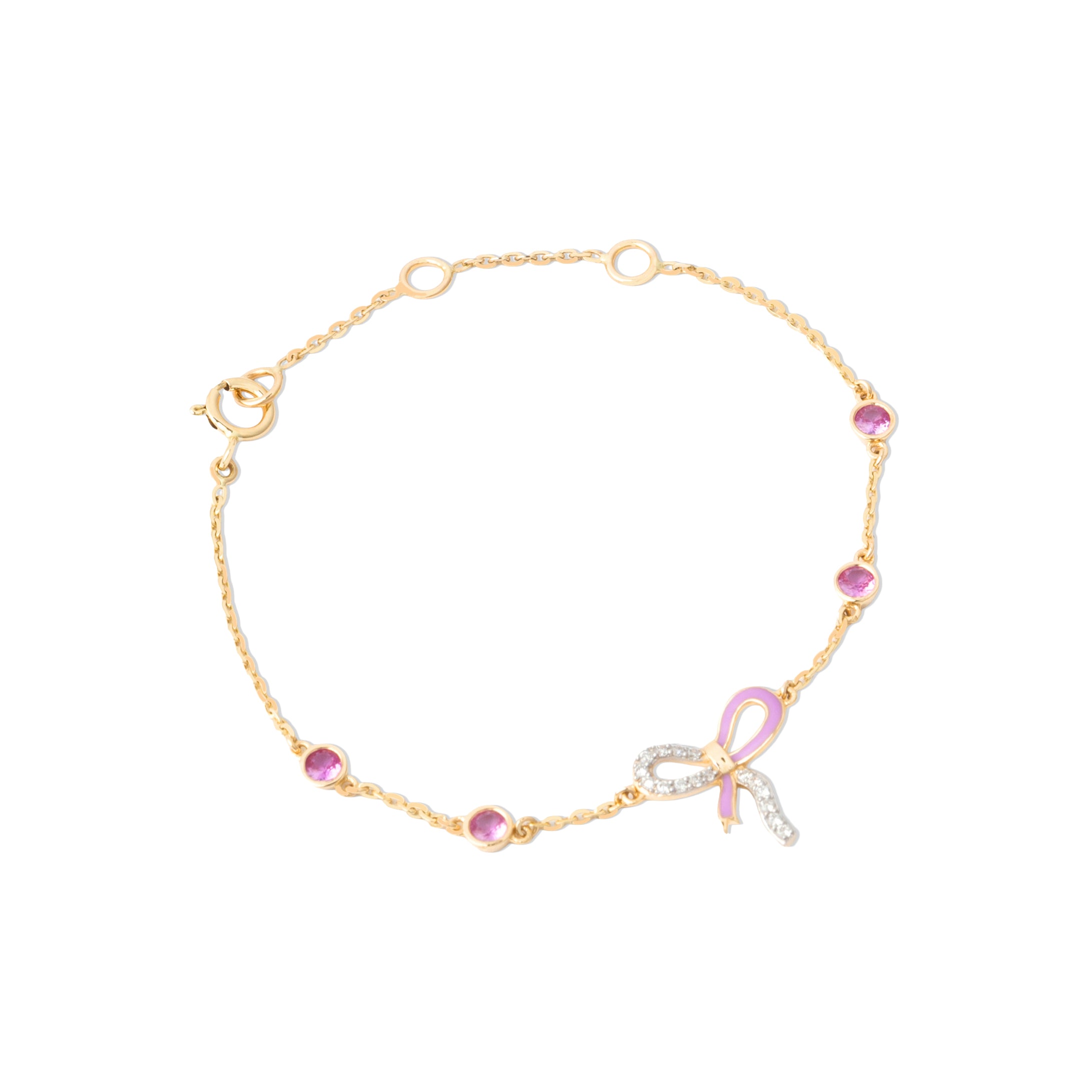 Tiny Jewels gold bracelet with pink and clear gemstones on a white background