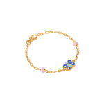 Tiny Jewels gold bracelet with a blue butterfly charm on a white background