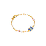 Tiny Jewels gold bracelet with a blue butterfly charm on a white background