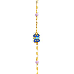 Tiny Jewels gold chain bracelet with blue butterfly charm on a white background