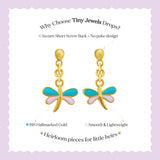 Tiny Jewels gold dragonfly-shaped earrings with green and pink details on a white background.