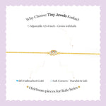 Tiny Jewels gold bracelet with text on a white background