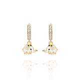 Tiny Jewels gold elephant earrings with diamond accents on a white background