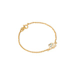 Tiny Jewels gold bracelet with a small owl charm on a white background