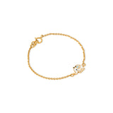 Tiny Jewels gold bracelet with a small owl charm on a white background