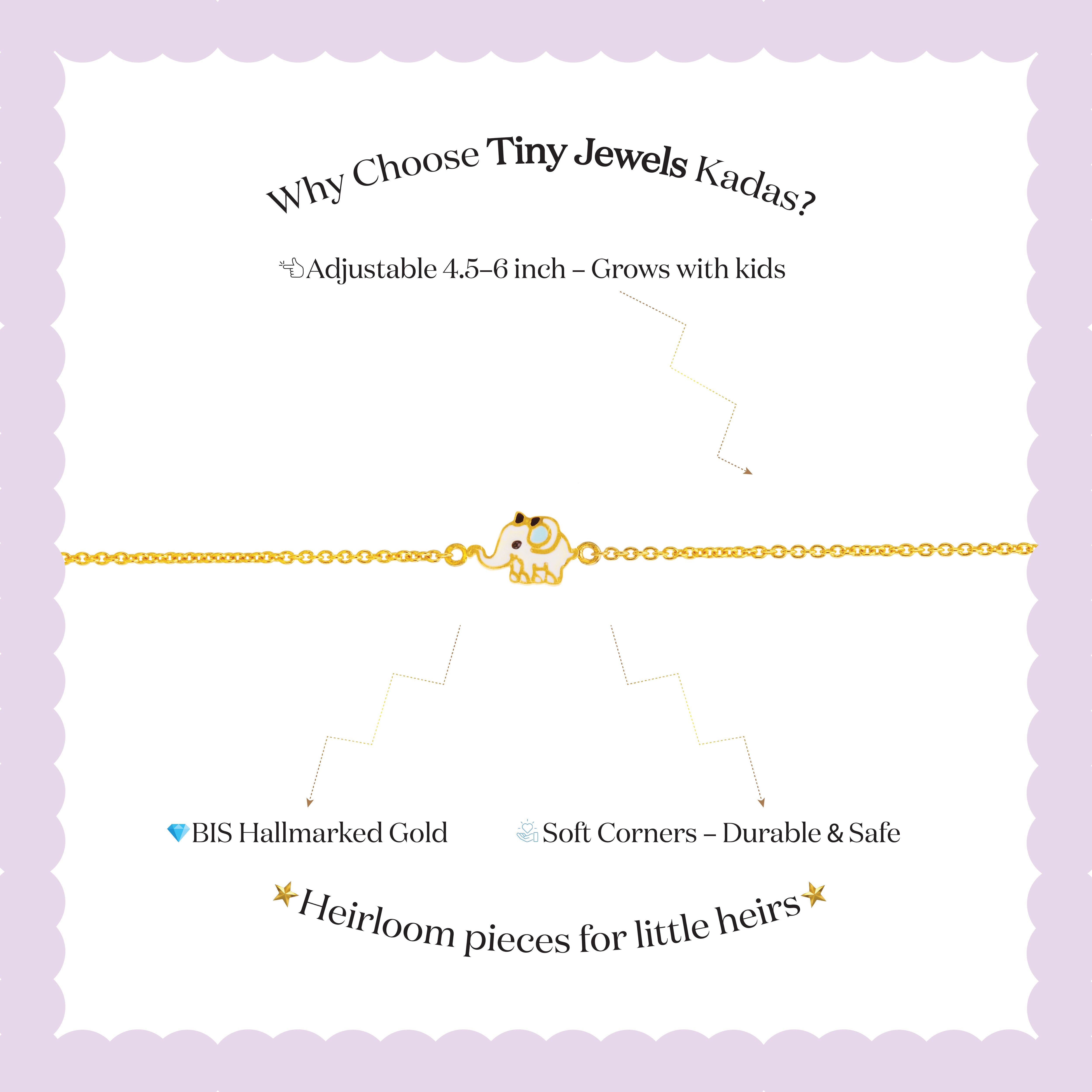 Tiny Jewels gold bracelet with a small owl charm on a child's wrist against a white background