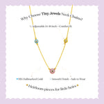 Tiny Jewels gold necklace with small round pendants on a light purple background, featuring text about the product.
