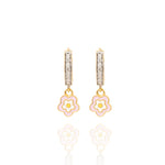 Tiny Jewels gold hoop earrings with pink flower charms on a white background