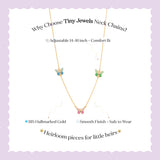 Tiny Jewels necklace with decorative elements on a light purple background
