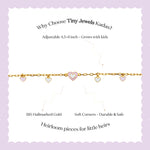 Tiny Jewels gold bracelet with heart-shaped charms on a white background with text about Tiny Jewels Kadas.